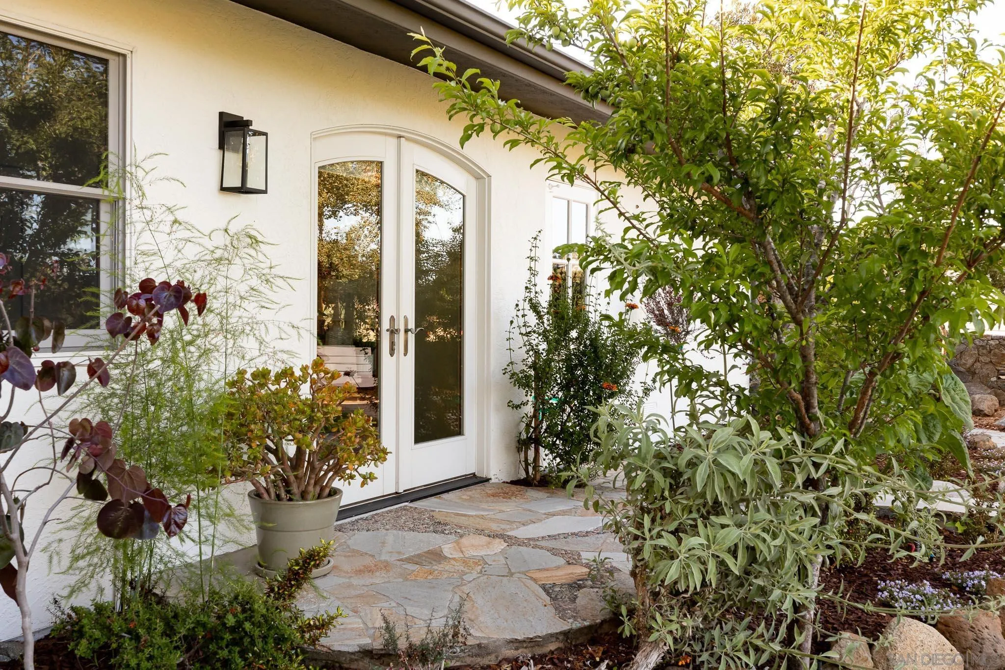 1496 Hymettus Avenue Encinitas, CA 92024 - Photo 17 of 53 a view of a house with a flower garden