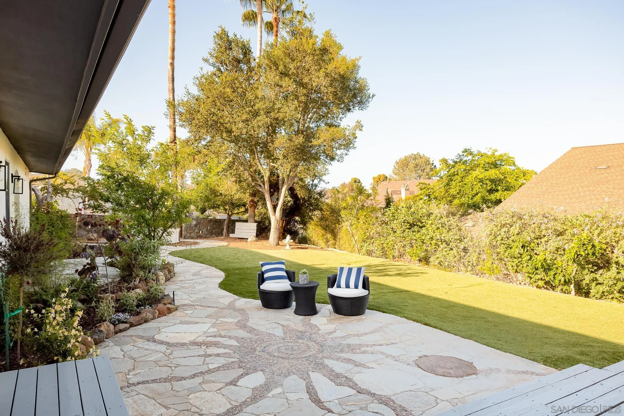 1496 Hymettus Avenue Encinitas, CA 92024 - Photo 25 of 53 a view of a patio with table and chairs and potted plants