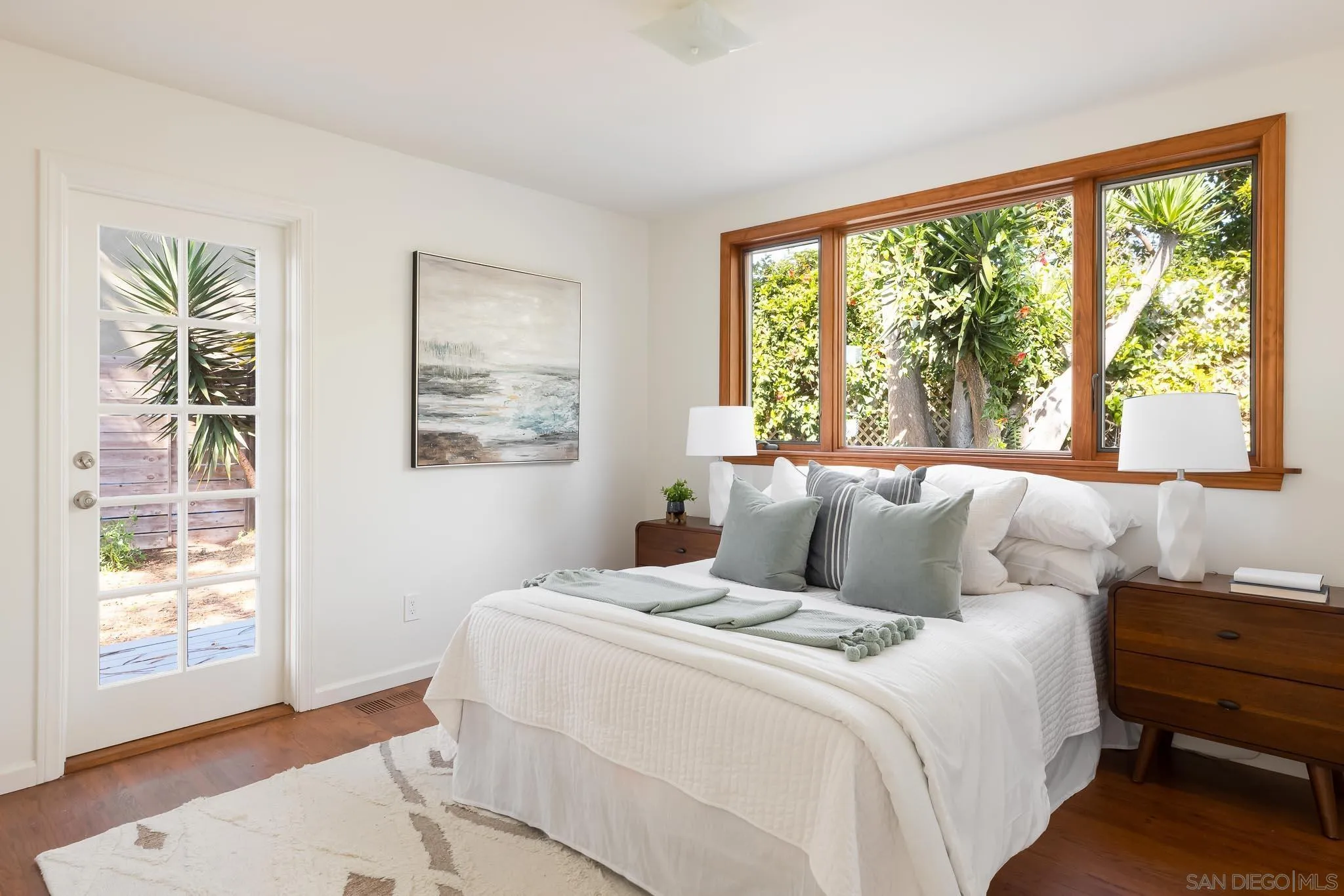 1496 Hymettus Avenue Encinitas, CA 92024 - Photo 26 of 53 a bedroom with a large bed and a large window