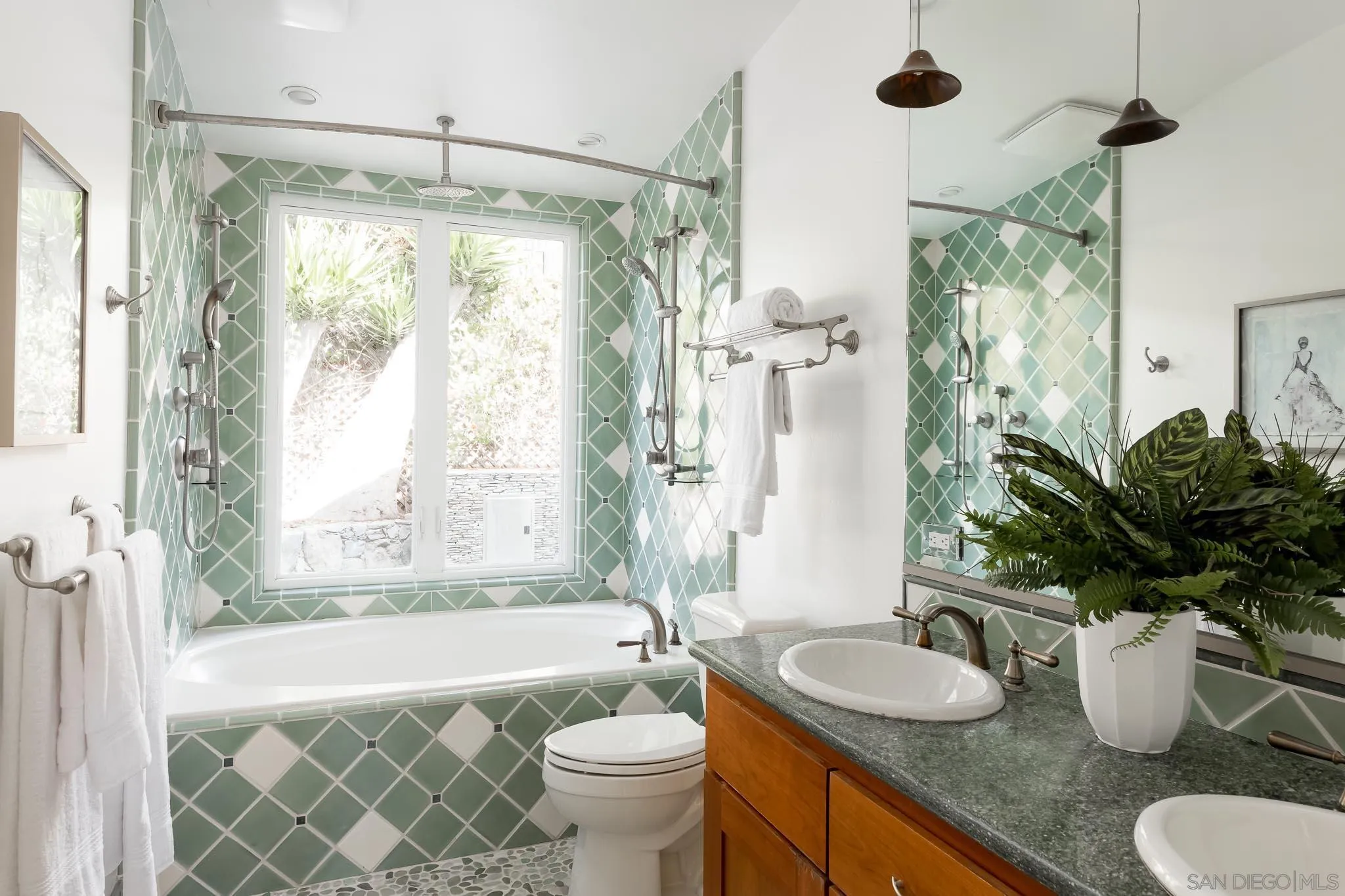 1496 Hymettus Avenue Encinitas, CA 92024 - Photo 30 of 53 a bathroom with a granite countertop sink toilet a mirror and shower