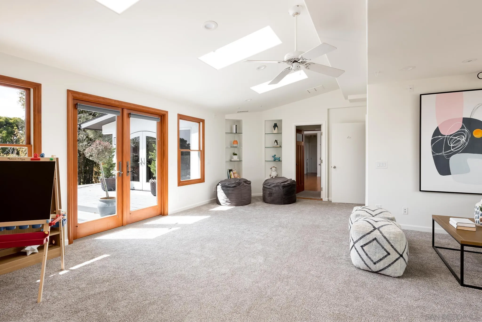1496 Hymettus Avenue Encinitas, CA 92024 - Photo 32 of 53 a bed room with furniture and a flat screen tv