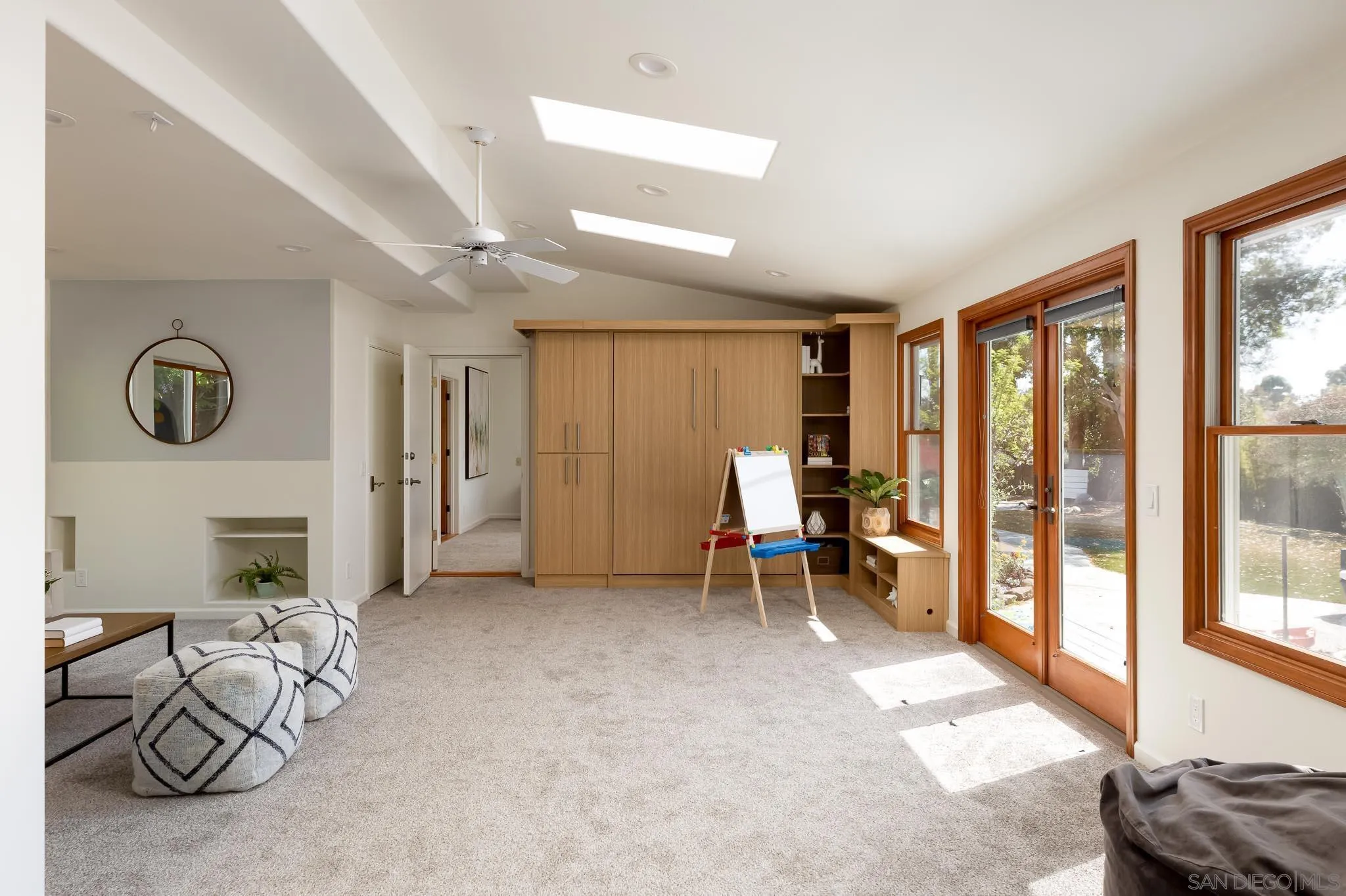 1496 Hymettus Avenue Encinitas, CA 92024 - Photo 33 of 53 a living room with furniture and a floor to ceiling window