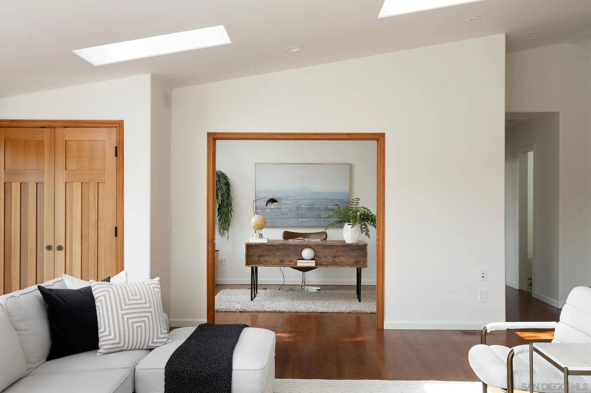 1496 Hymettus Avenue Encinitas, CA 92024 - Photo 36 of 53 a living room with furniture and a mirror