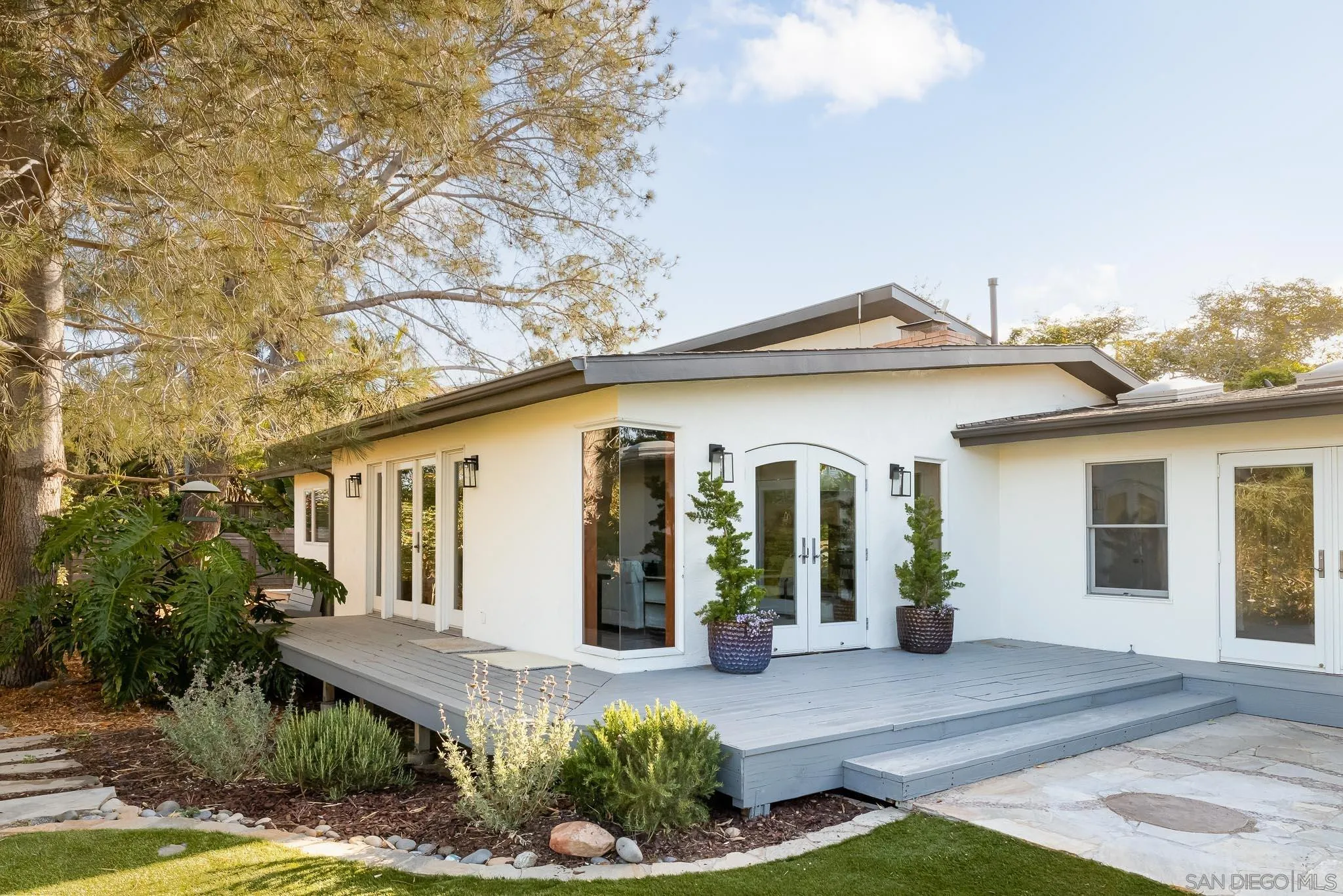1496 Hymettus Avenue Encinitas, CA 92024 - Photo 4 of 53 a front view of a house with garden