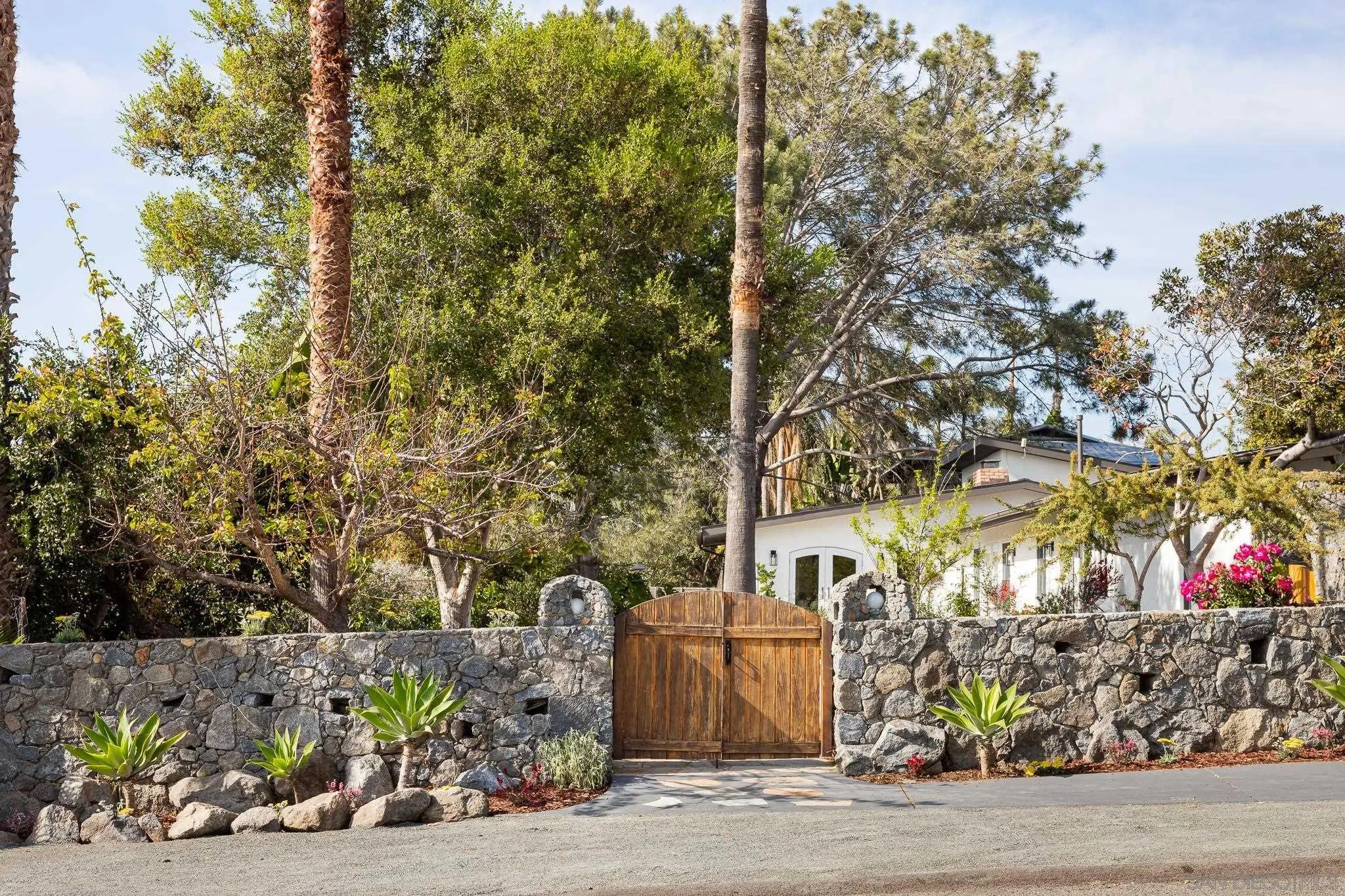 1496 Hymettus Avenue Encinitas, CA 92024 - Photo 45 of 53 a view of a street with potted plants