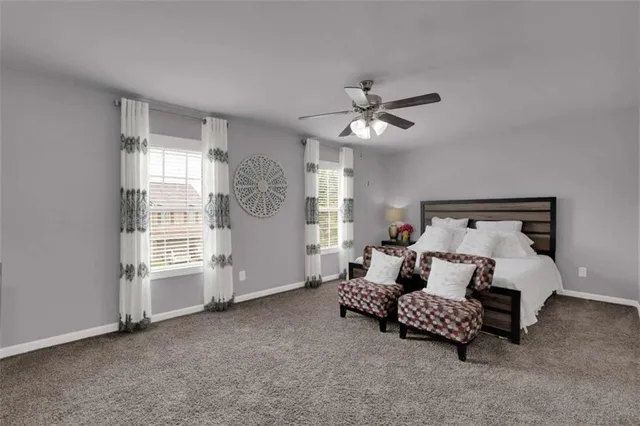 a bedroom with bed and window