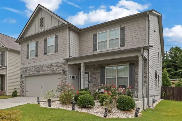 front view of a house with a yard