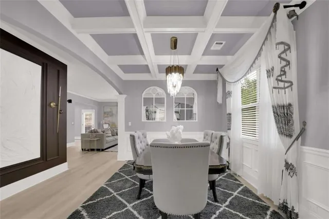 a dining room with furniture and window