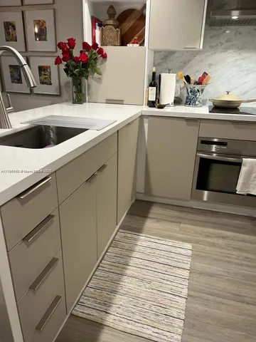 a kitchen with a sink and cabinets