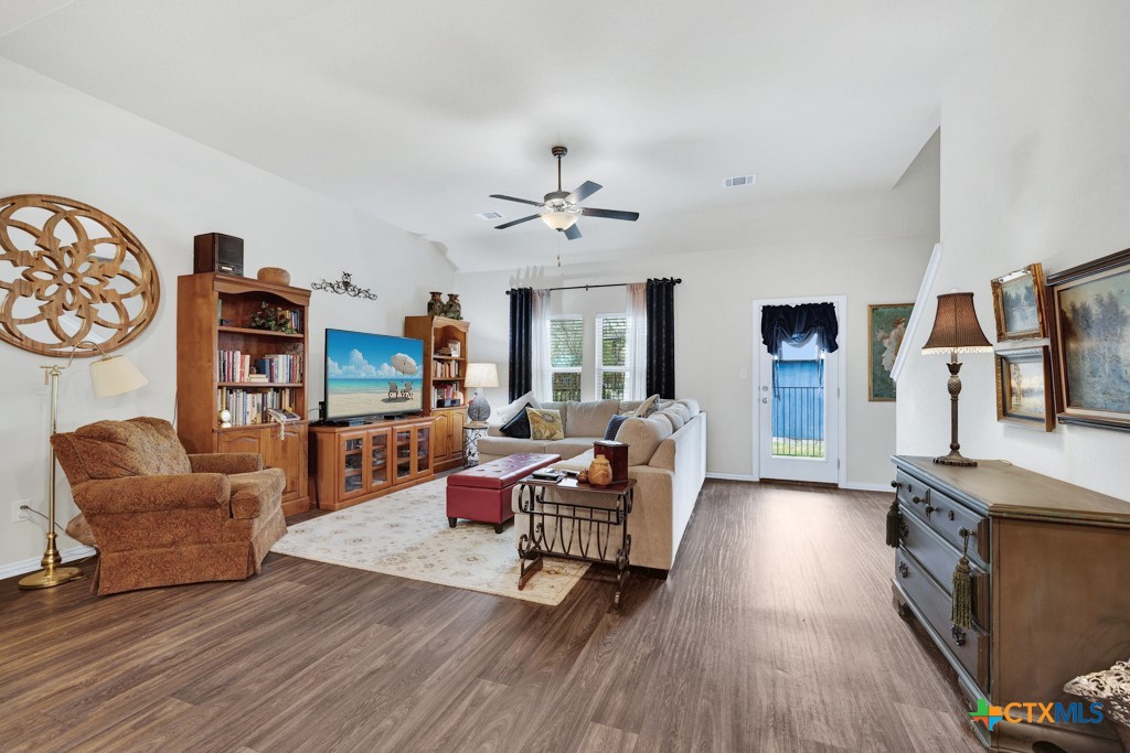 1444 Harwell Loop Kyle, TX 78640 - Photo 11 of 37 a living room with furniture and a wooden floor