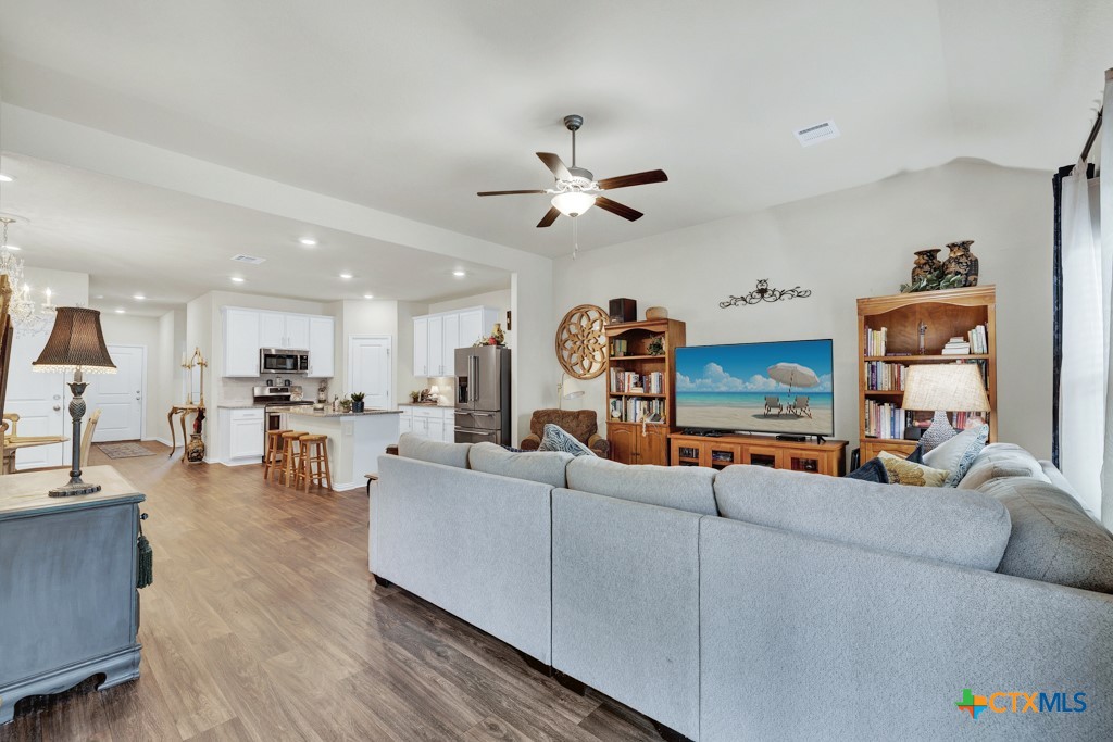 1444 Harwell Loop Kyle, TX 78640 - Photo 13 of 37 a living room with furniture and kitchen view