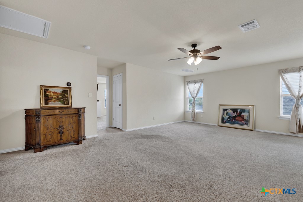 1444 Harwell Loop Kyle, TX 78640 - Photo 23 of 37 a view of a livingroom with a window and a kitchen