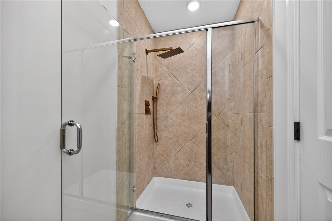 811 Wind Bluff Point Springboro, OH 45066 - Photo 22 of 51 This sleek glass-enclosed shower features contemporary tile work and modern fixtures, creating a refreshing bathing experience.