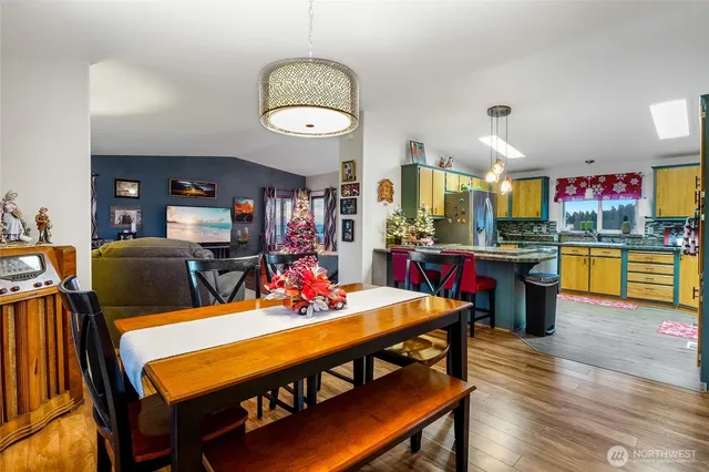 a view of a dining room with furniture and wooden floor