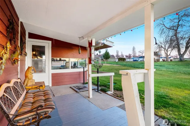 a balcony with furniture and a garden