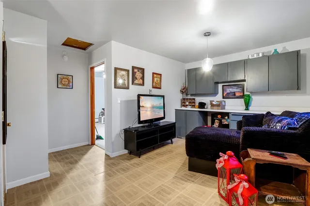 a bedroom with furniture and a baby crib