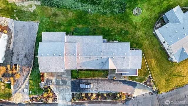 an aerial view of a house with a swimming pool