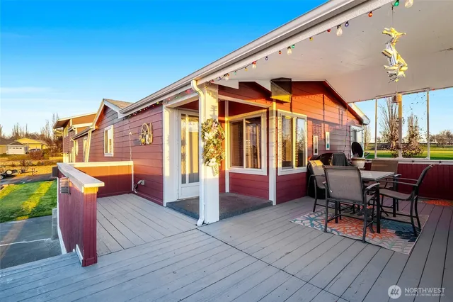 a front view of a house with outdoor seating