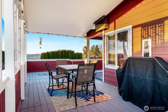 a view of a patio with table and chairs
