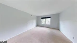 a view of a window in an empty room