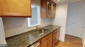 a kitchen with a sink and a refrigerator