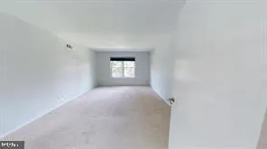 a view of empty room with windows