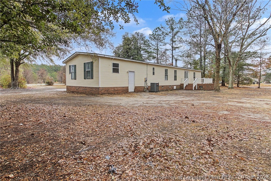 1512 Seabrook School Road Fayetteville, NC 28312 - Photo 28 of 30 a view of a house with a yard