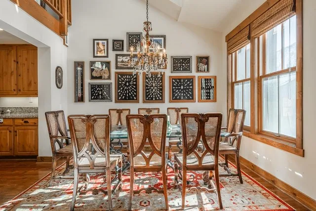 a view of a dining room with furniture and window