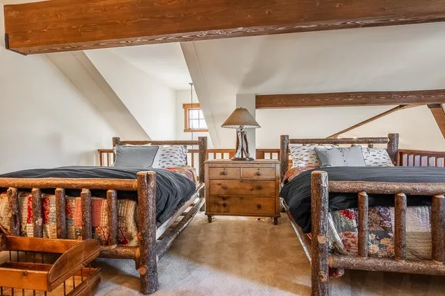 a bedroom with furniture and a window