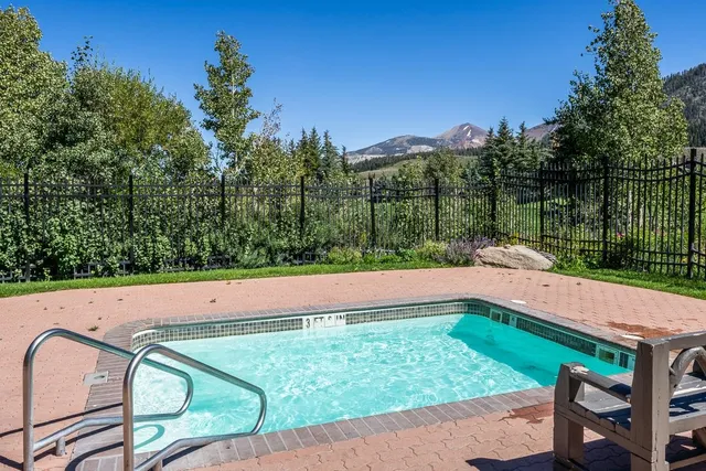 a view of a garden with a building in the background