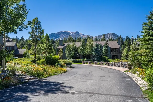 a view of a lake with a house in the background