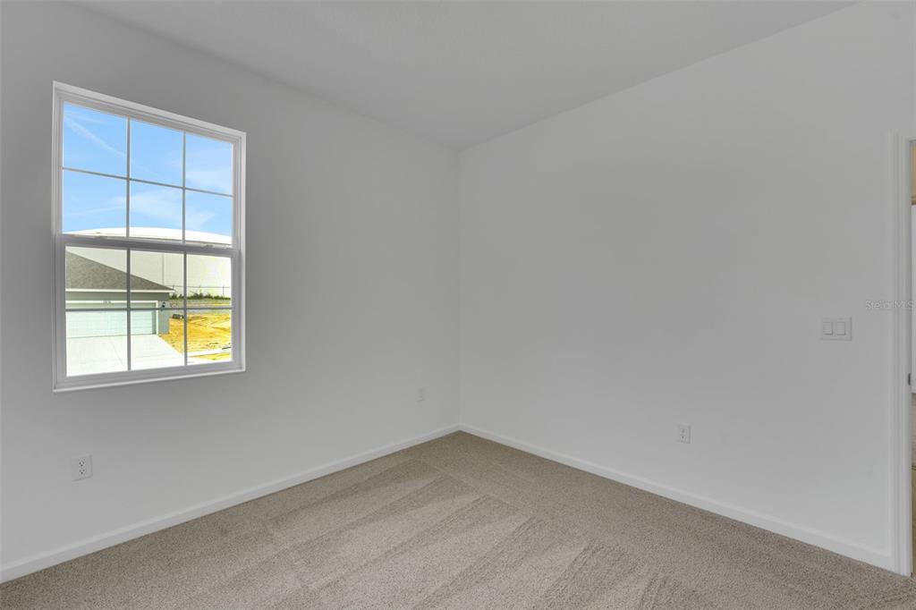 2857 Doolittle Street Tavares, FL 32778 - Photo 11 of 31 an empty room with a window