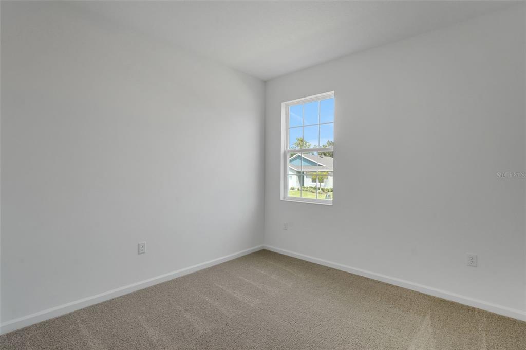 2857 Doolittle Street Tavares, FL 32778 - Photo 12 of 31 a view of an empty room with a window