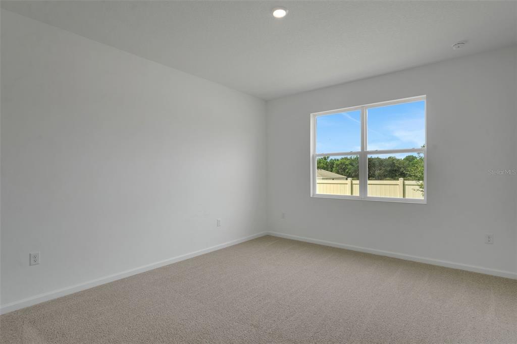 2857 Doolittle Street Tavares, FL 32778 - Photo 22 of 31 an empty room with a window