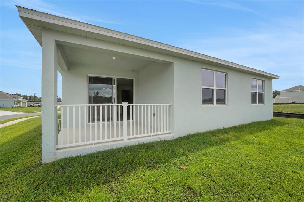 2857 Doolittle Street Tavares, FL 32778 - Photo 28 of 31 a view of backyard with garden