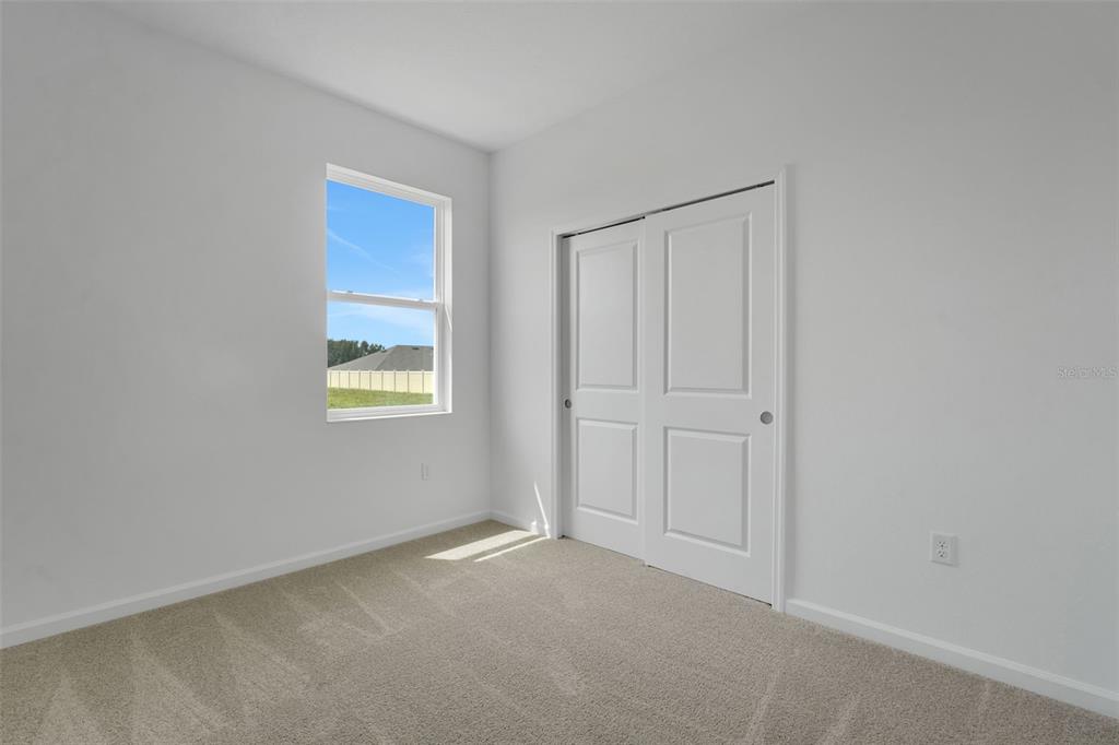 2857 Doolittle Street Tavares, FL 32778 - Photo 7 of 31 a view of an empty room with a window