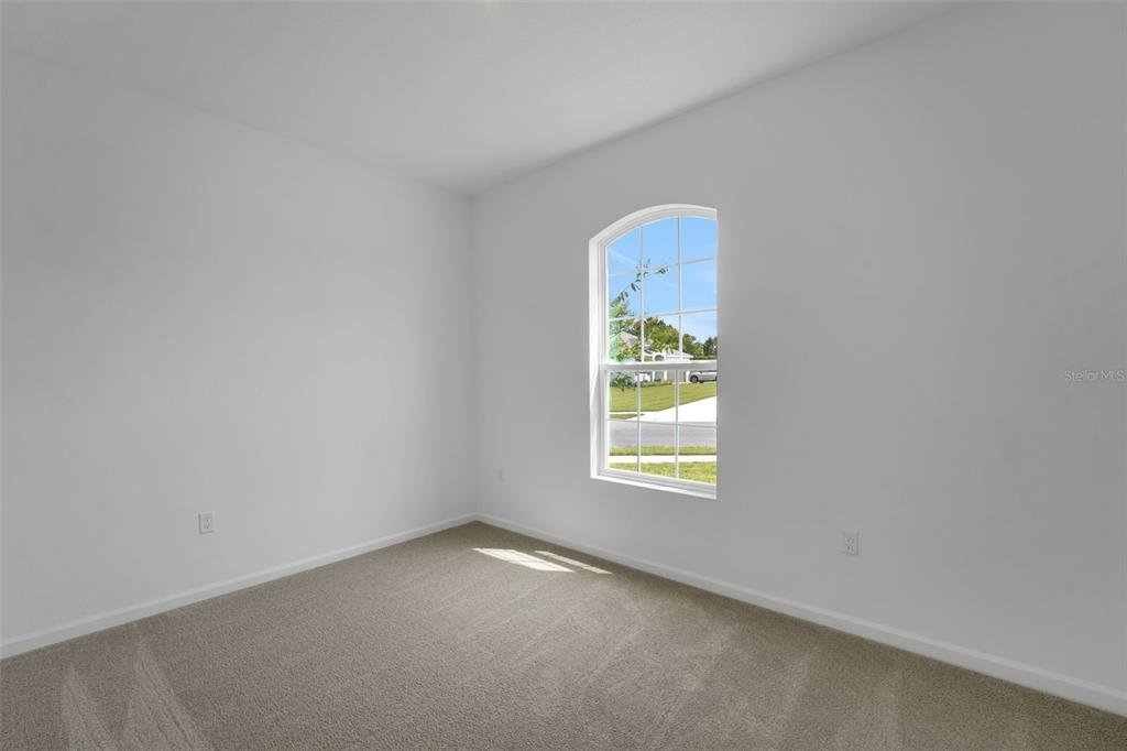 2857 Doolittle Street Tavares, FL 32778 - Photo 10 of 31 an empty room with a window