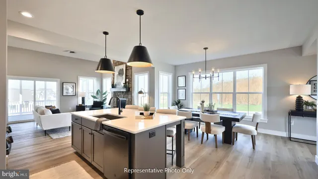 a living room with furniture a window and a table