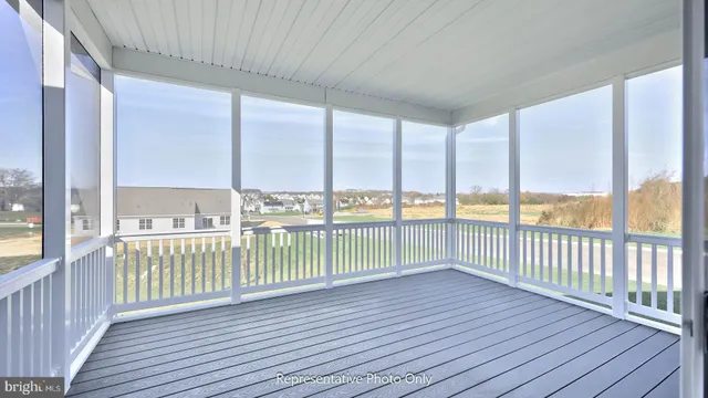 a view of a balcony with wooden floor