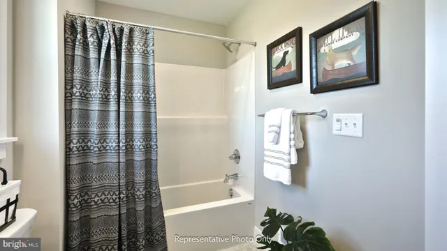 a bathroom with a bathtub and shower