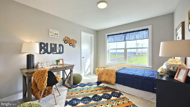 a bed room with furniture and a window