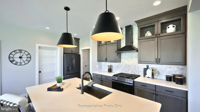 a kitchen with a table and chairs