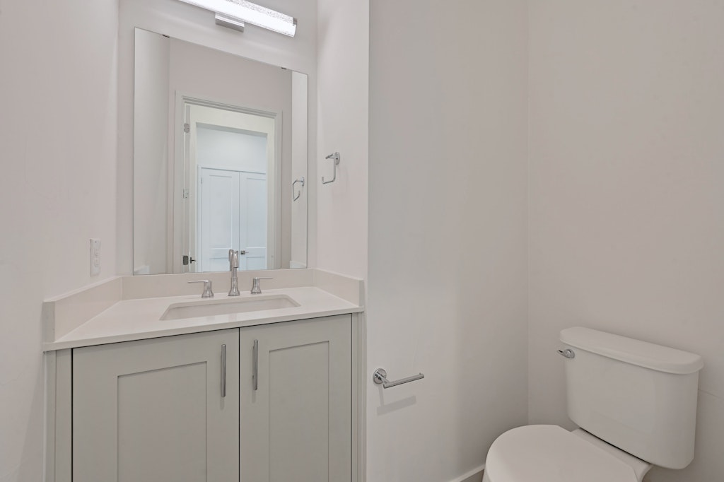 6805 Adeline Way, Unit 17 Austin, TX 78746 - Photo 15 of 38 Bathroom featuring vanity and toilet