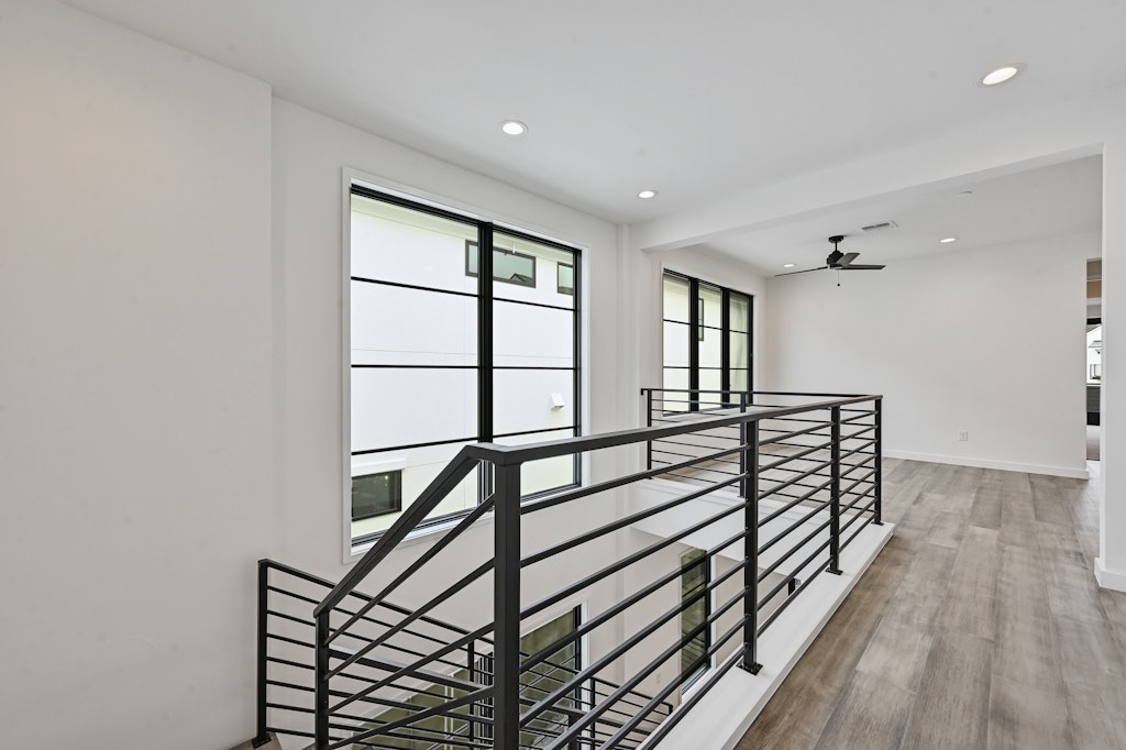 6805 Adeline Way, Unit 17 Austin, TX 78746 - Photo 21 of 38 Hall with recessed lighting, light wood-type flooring, and an upstairs landing