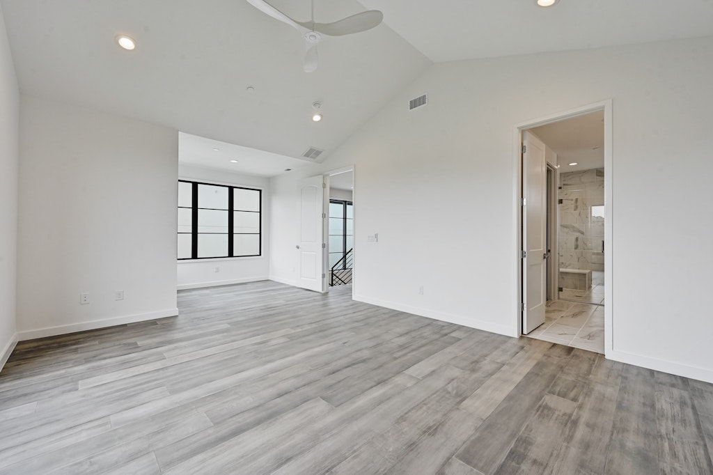 6805 Adeline Way, Unit 17 Austin, TX 78746 - Photo 25 of 38 Empty room with recessed lighting, vaulted ceiling, light wood-style flooring, and ceiling fan