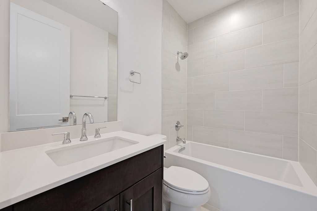 6805 Adeline Way, Unit 17 Austin, TX 78746 - Photo 30 of 38 Bathroom featuring bathtub / shower combination and vanity