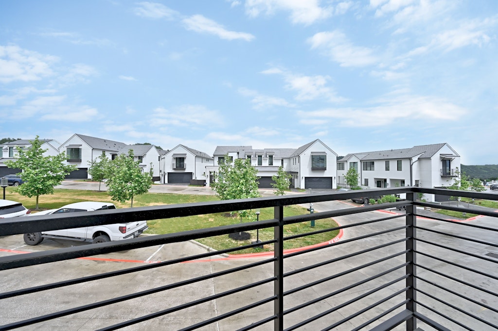 6805 Adeline Way, Unit 17 Austin, TX 78746 - Photo 33 of 38 Balcony featuring a residential view