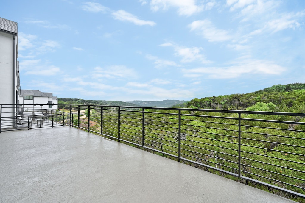 6805 Adeline Way, Unit 17 Austin, TX 78746 - Photo 36 of 38 Balcony featuring a mountain view