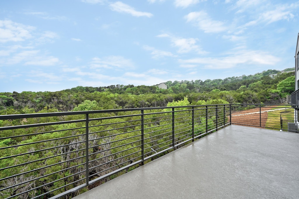 6805 Adeline Way, Unit 17 Austin, TX 78746 - Photo 37 of 38 Balcony with a view of trees