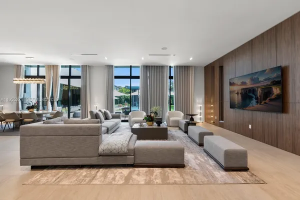 a bedroom with a bed couch and a window